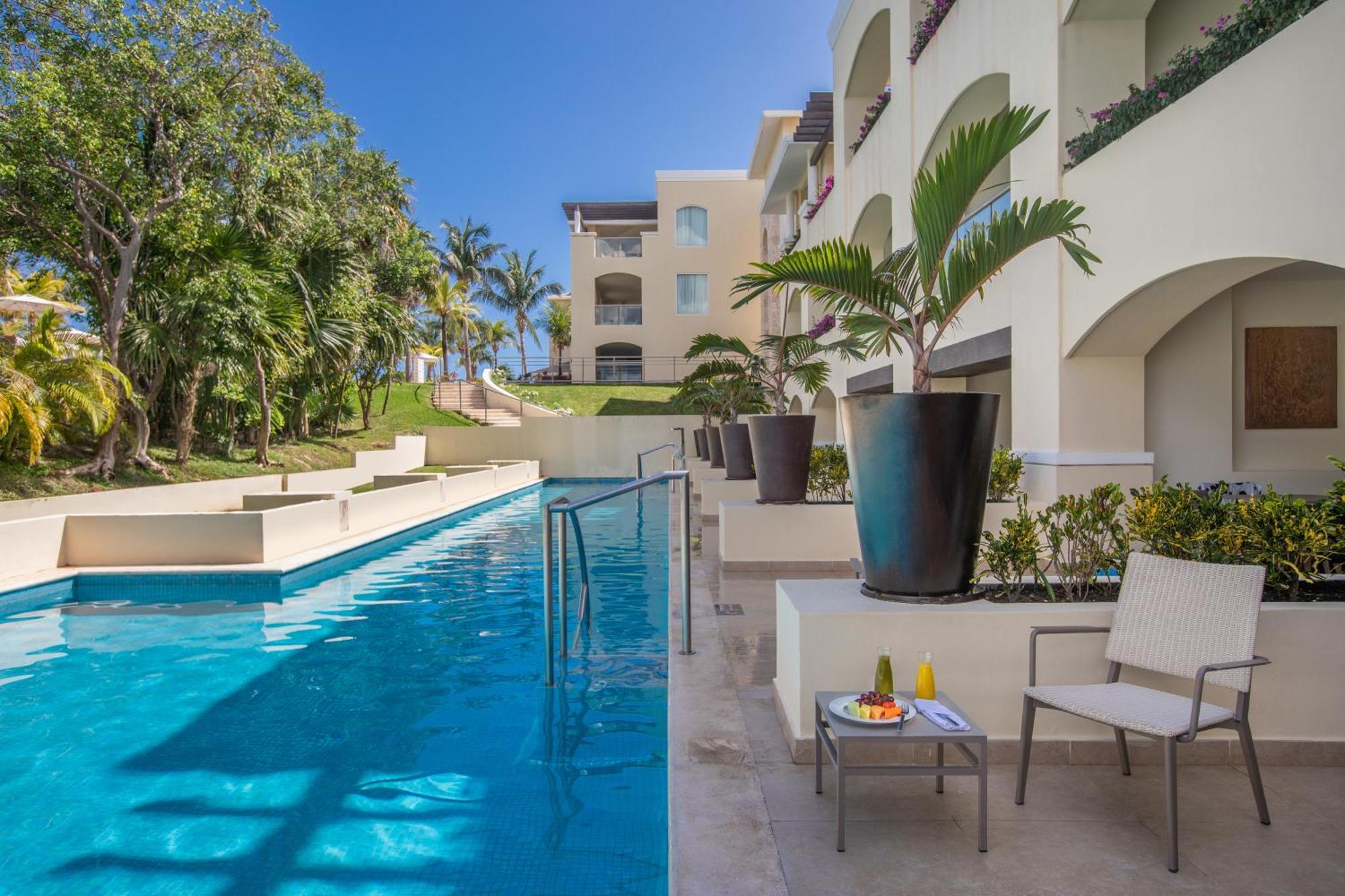 Suite Grand con acceso directo a la piscina y vistas al jardín